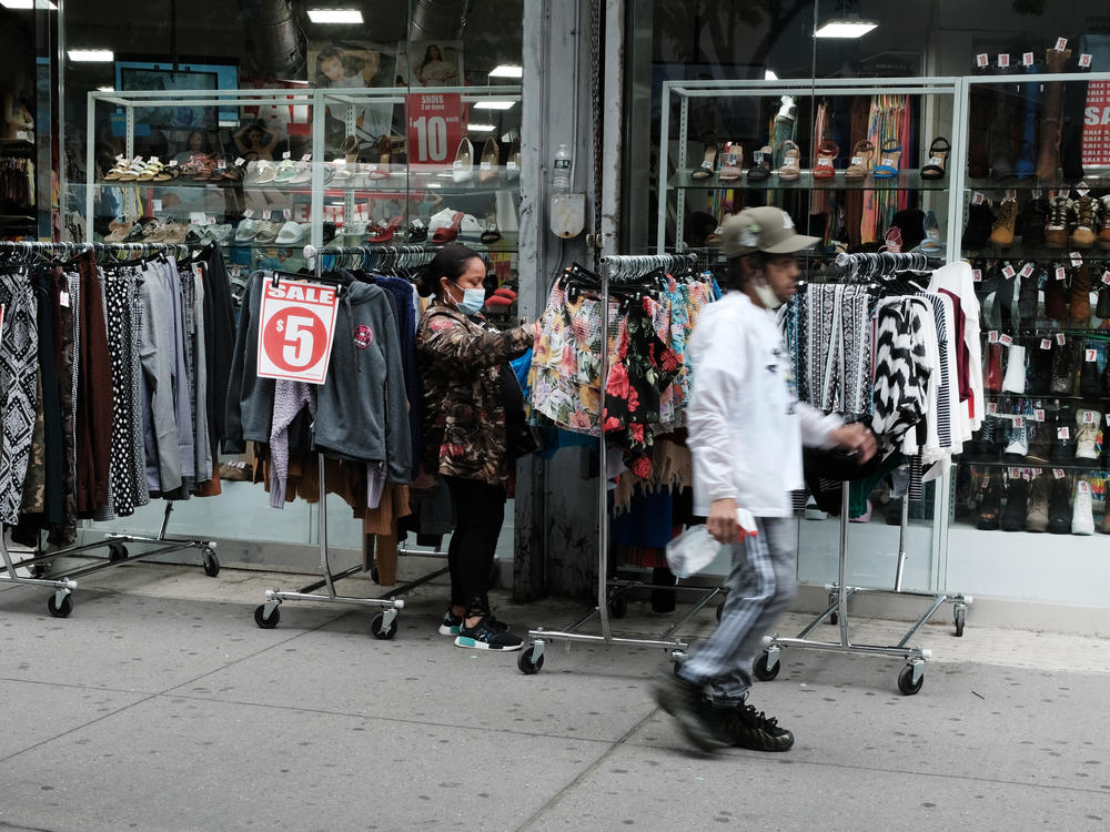 People shop in the Brooklyn borough of New York City in May. Poverty declined in 2020, according to the U.S. Census Bureau's Supplemental Poverty Measure.