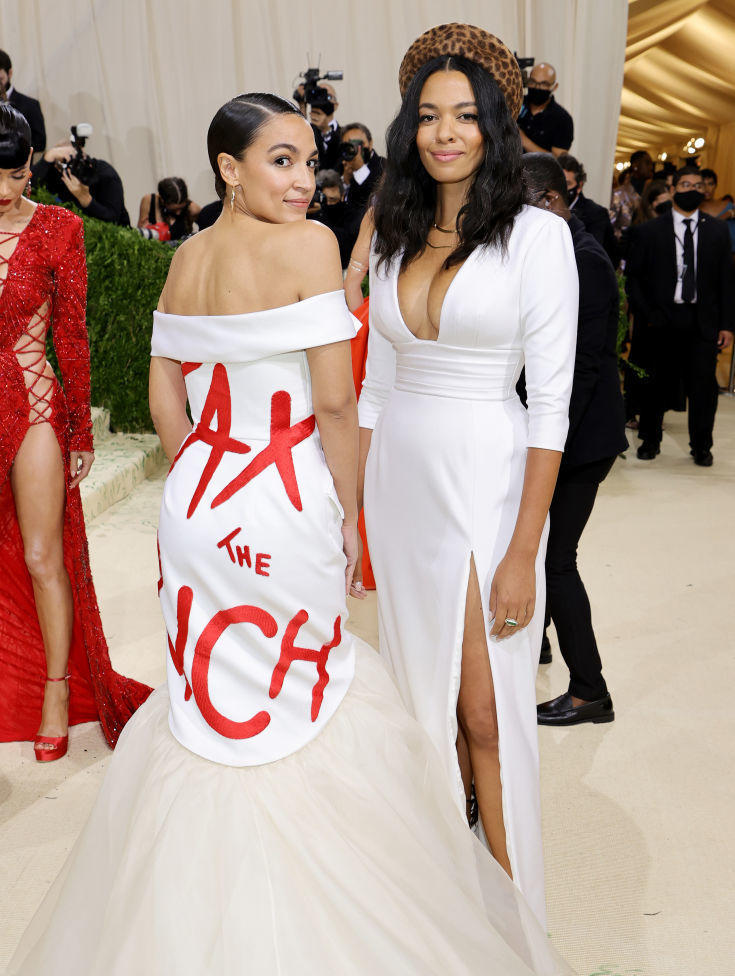 Rep. Alexandria Ocasio-Cortez, D-N.Y., arrives with designer Aurora James.