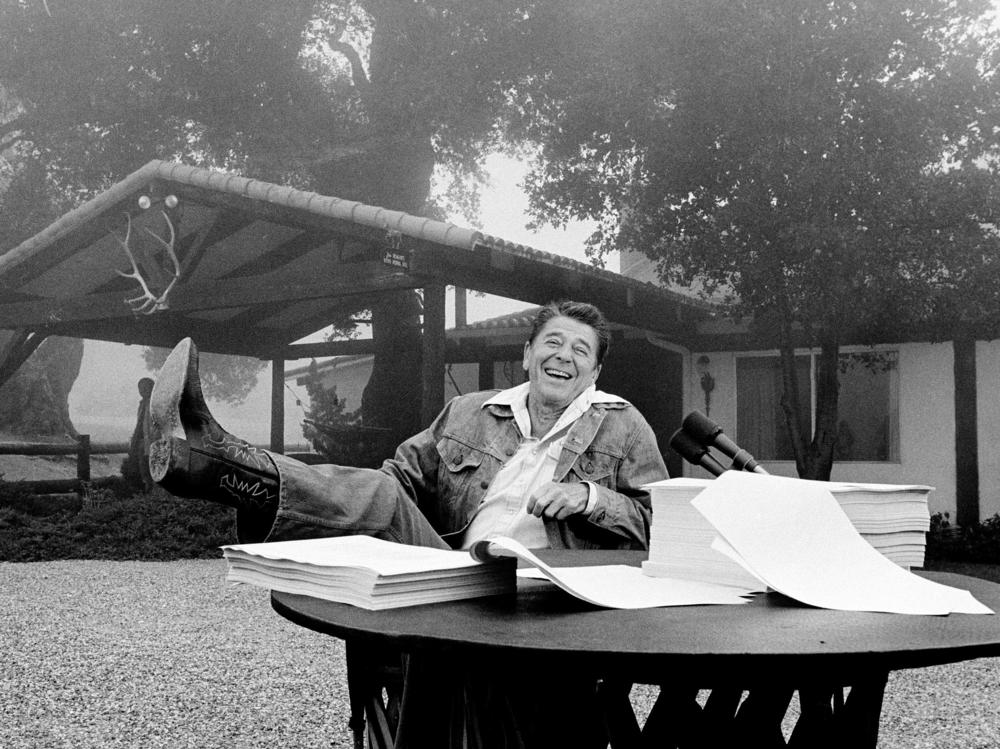 President Ronald Reagan shows his boot following the signing of his tax bill in August 1981 at his vacation home near Santa Barbara, Calif.