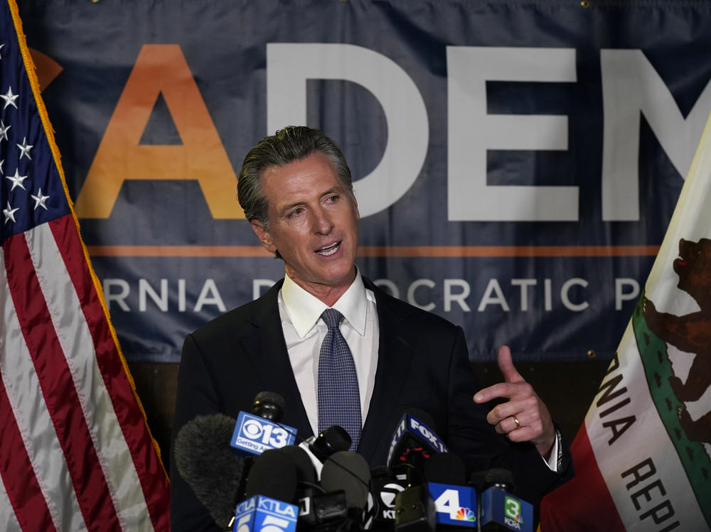 California Gov. Gavin Newsom addresses reporters Tuesday in Sacramento after beating back the recall effort that aimed to remove him from office.