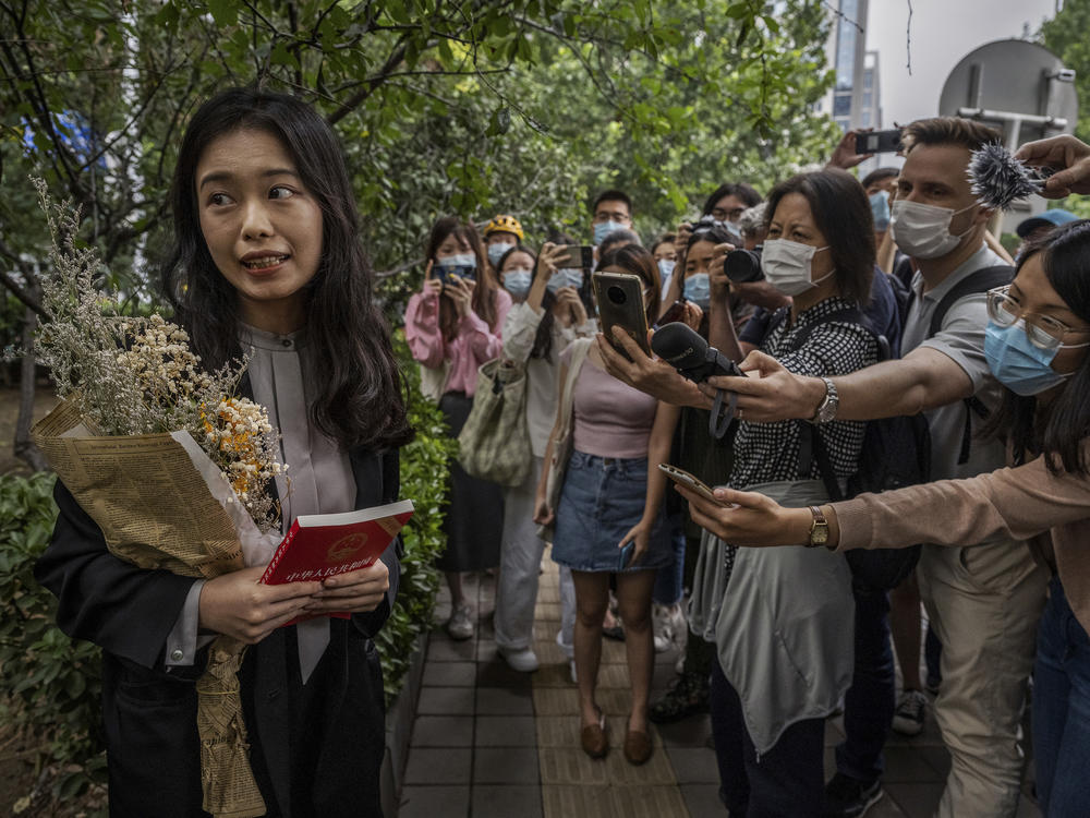 Zhou Xiaoxuan speaks to journalists and supporters on Sept. 14 outside the Haidian District People's Court in Beijing before a hearing in her case. She alleged that she was groped and forcibly kissed by prominent TV anchor Zhu Jun, who denies the allegations and has countersued for defamation. The court ruled there was not sufficient evidence of sexual harassment.