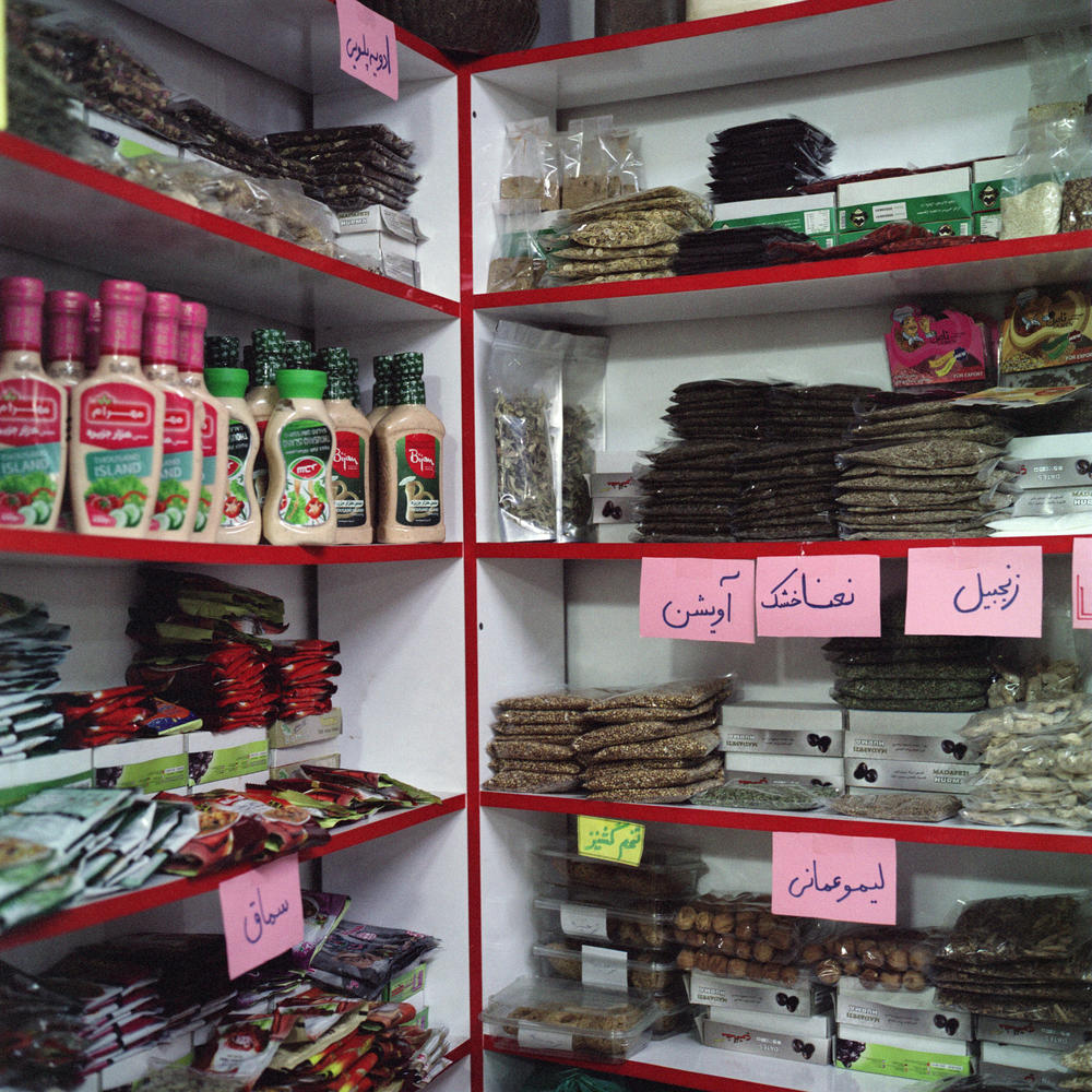Spices, candies and other goods familiar to Afghans line the shelves of a store in Trabzon owned by Ahmad Javaheri, who is from the western Afghan city of Herat.