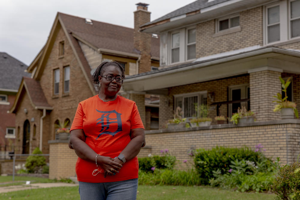 Theresa Bonham stands in front of her home in the Jefferson Chalmers neighborhood in Detroit. A storm on June 26 caused extreme flooding resulting in extensive water damage to Bonham's basement.