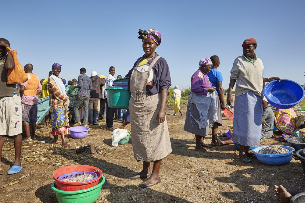 A scene from Nduru Beach in 2019, before rising waters flooded the village. When the fishing boats would come in with their morning catch, female fishmongers would negotiate fish they could sell. Sex was sometimes part of the transaction. But the women in the No Sex for Fish collective weren't at the mercy of the fishermen. They owned their own boats and hired men to do the fishing for them.