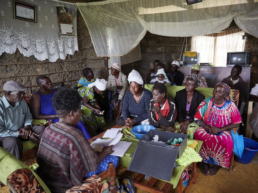 A meeting of the table banking group at the home of a member. The photo is from 2019, when No Sex for Fish (and the village) were thriving.