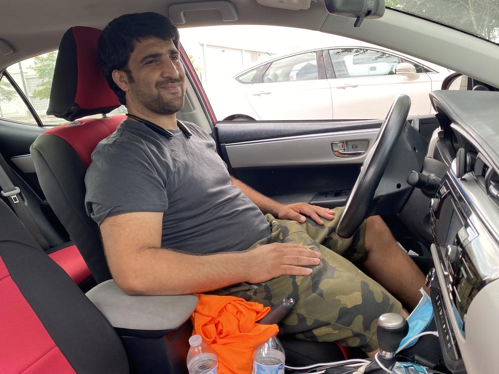Ahmad Zai Ahmadi arrived in the U.S. just as the coronavirus pandemic was forcing a shutdown. He started delivering food for Grubhub and DoorDash, working 12 hours a day, as a way to support his family.