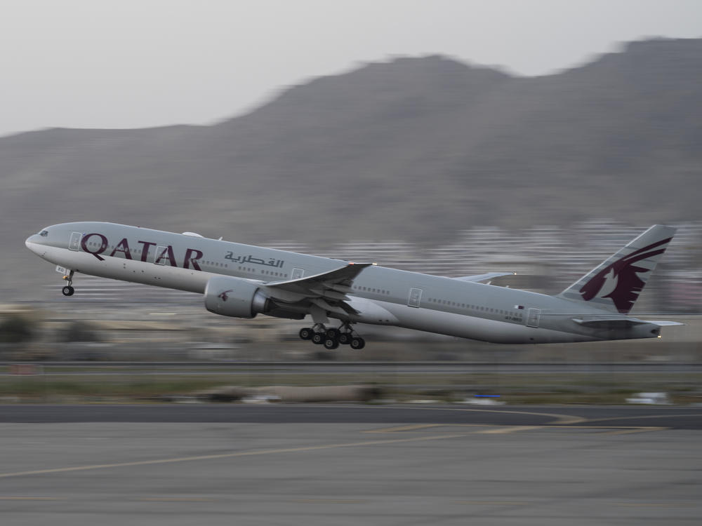 In this Sept. 9, 2021, photo, a Qatar Airways aircraft takes off with foreigners from the airport in Kabul, Afghanistan.