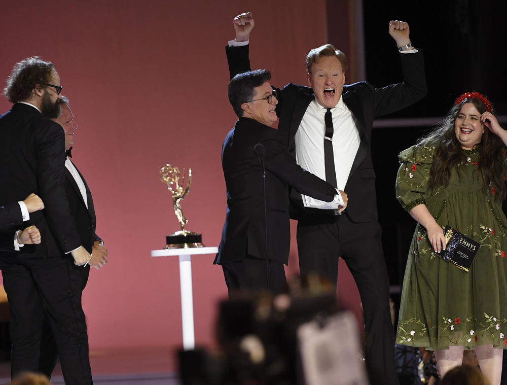 Conan O'Brien, right, congratulates Stephen T. Colbert for his Emmy win for outstanding variety special (live) for 