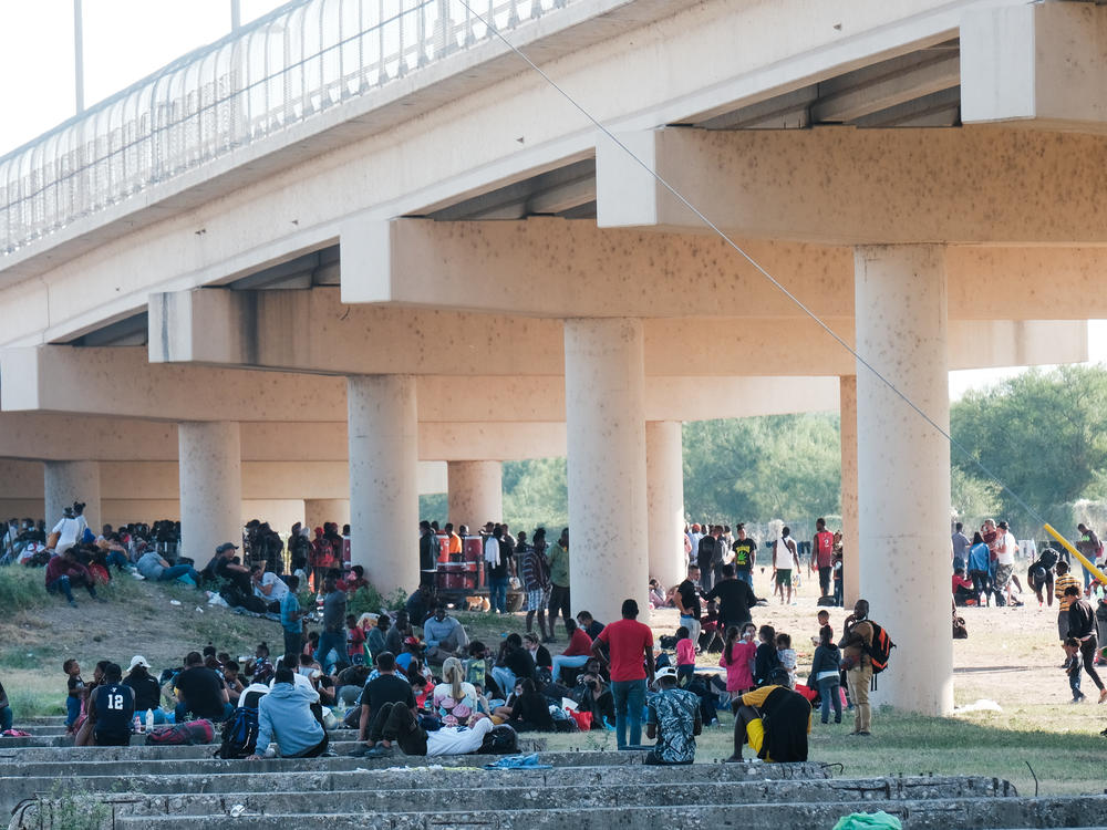 Migrants at the Rio Grande near the port of entry in Del Rio, Texas, on Saturday.