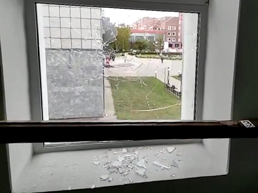 A broken window is pictured at the Perm State University where an unidentified man opened fire, killing at least eight people and injuring 24 others.