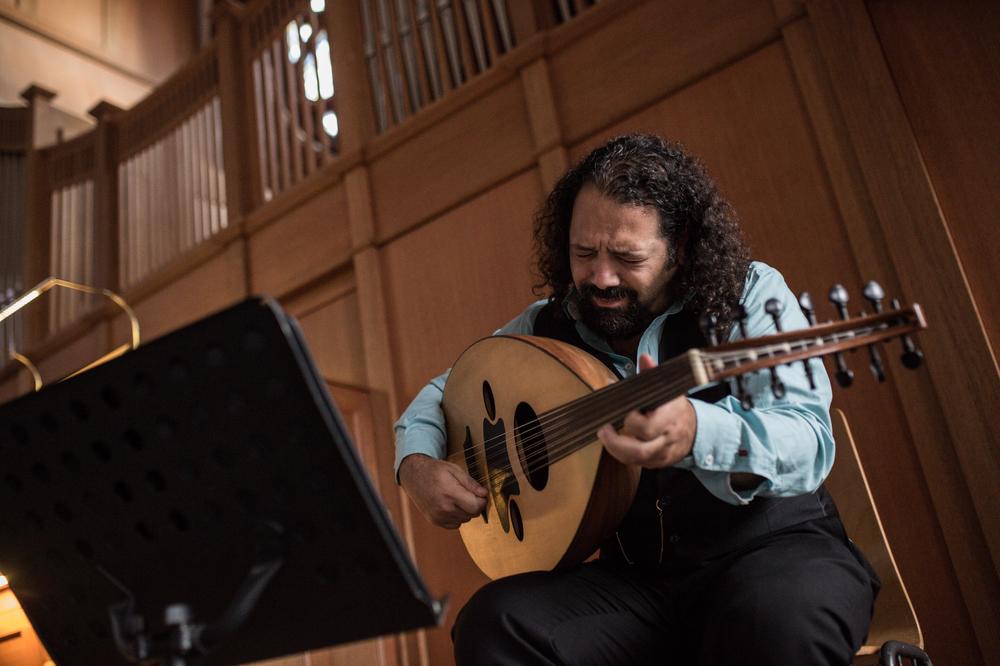 Wassim Mukdad plays the oud in Berlin. He says he never told his interrogators or anyone in prison in Syria he was a musician for fear they would hurt his hands.