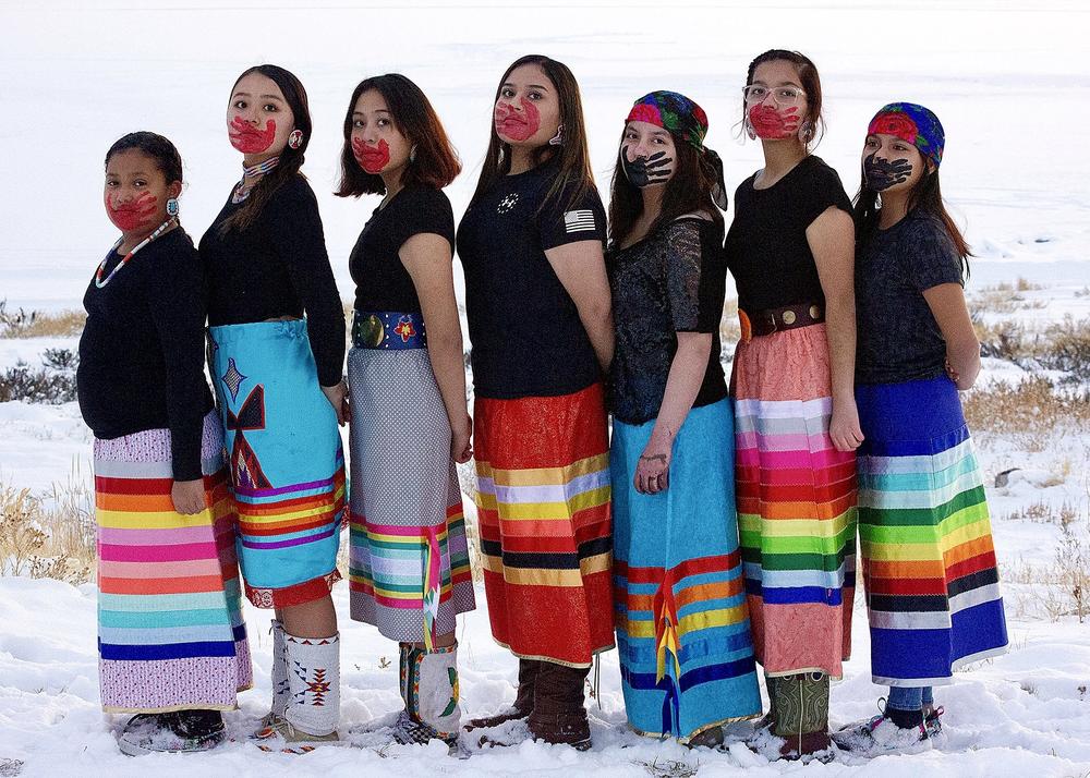 Ahyla Grey Bull, Destiny Spoonhunter, Kiera Spoonhunter, Alea Sanchez, Alicia Sanchez, Annalilla Sanchez and Arianna Sanchez pose for a portrait to raise awareness of missing and murdered Indigenous people.
