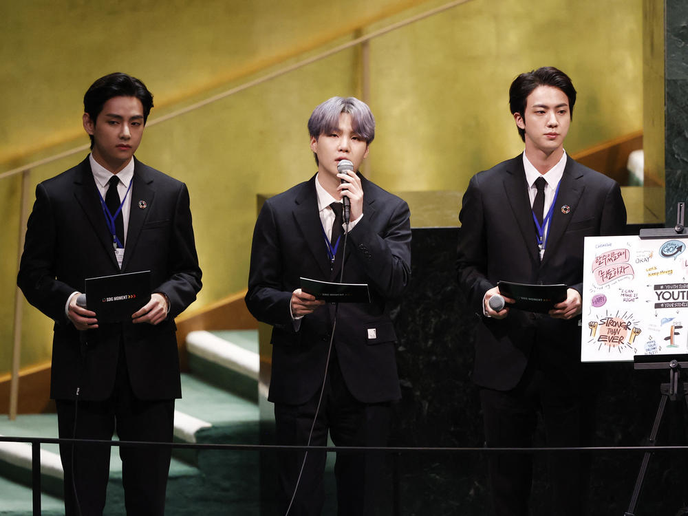 V (from left), Suga and Jin of BTS at the launch of the U.N. General Assembly's 76th session on Monday. The popular boy band from South Korea sang (in a video performance viewed online by more than 1 million) and spoke.