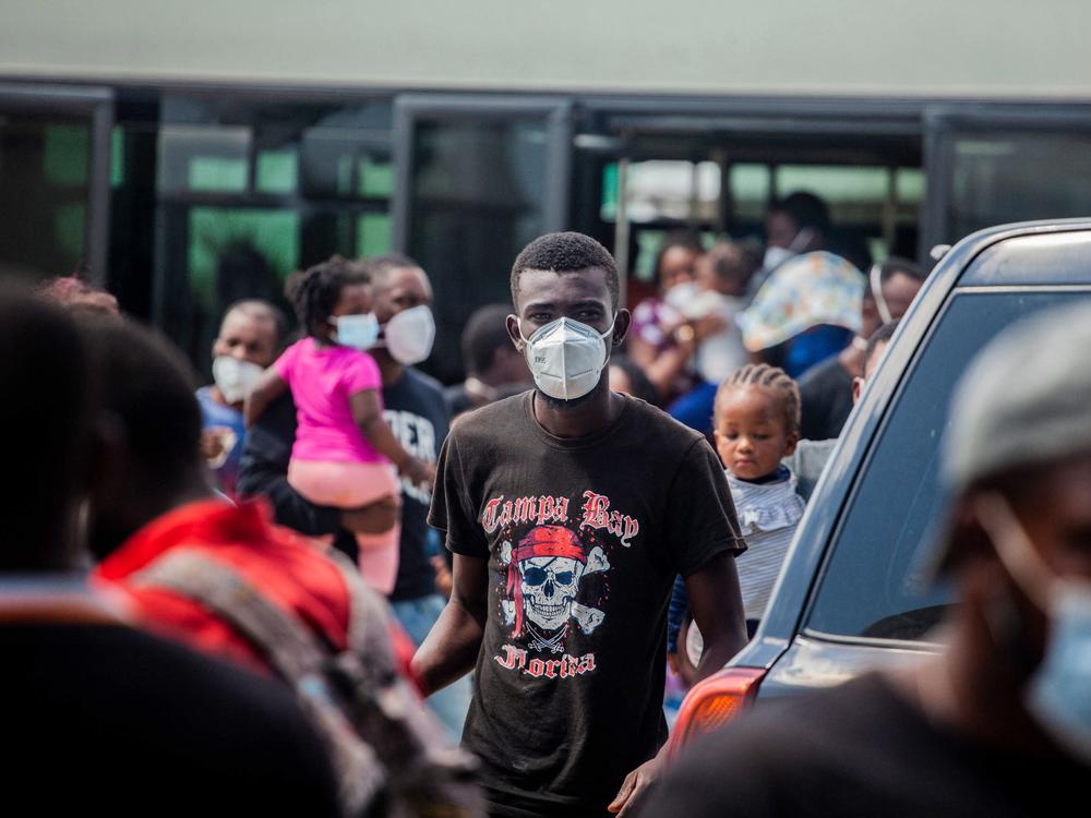 People deported by the U.S. to Haiti arrive Sunday at the Port-au-Prince airport. Expulsion flights from the U.S. reportedly are expected to ramp up to seven daily flights this week.