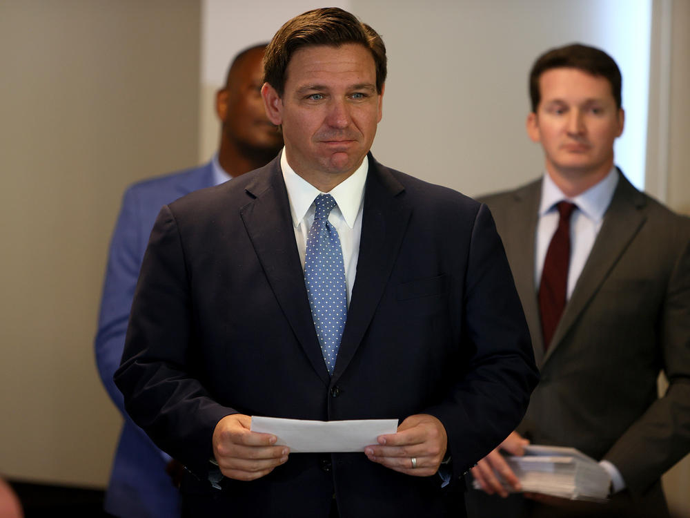 Florida Gov. Ron DeSantis, shown here in August, has appointed Dr. Joseph Ladapo as the state's new surgeon general. Ladapo says vaccines are not the only way to promote 