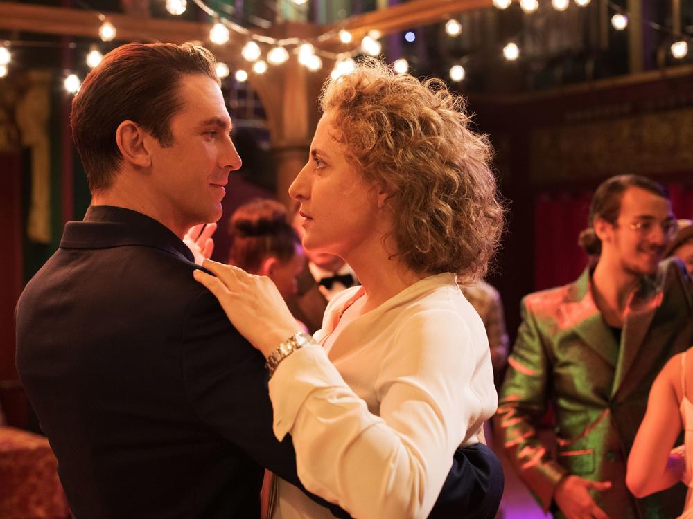 Tom (Dan Stevens) whisks a very skeptical Alma (Maren Eggert) around the dance floor as his precision-tooled algorithm tries to meet her every requirement for the perfect man.