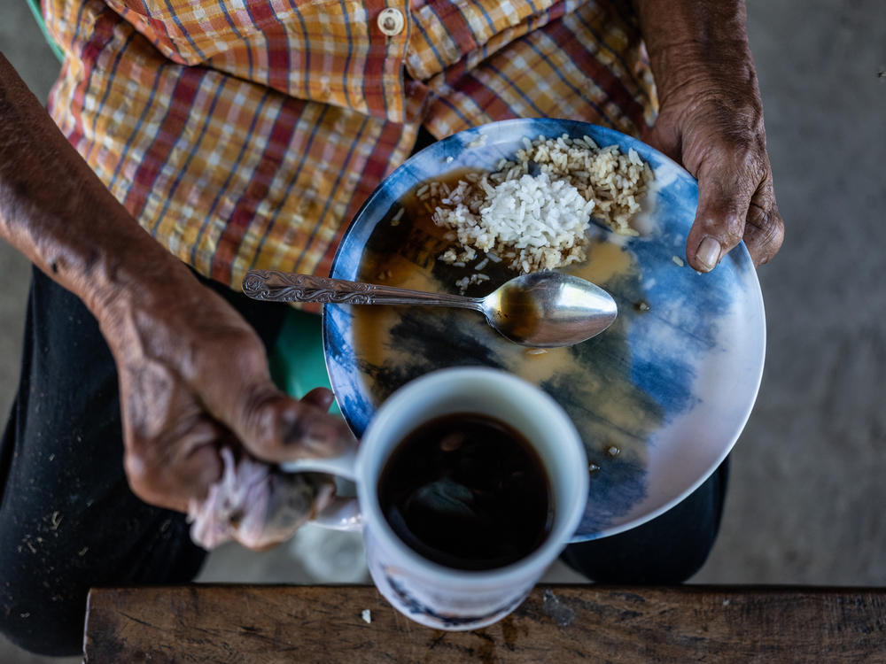 Hernandez eats rice with a little coffee poured on top for her meal. She calls it 