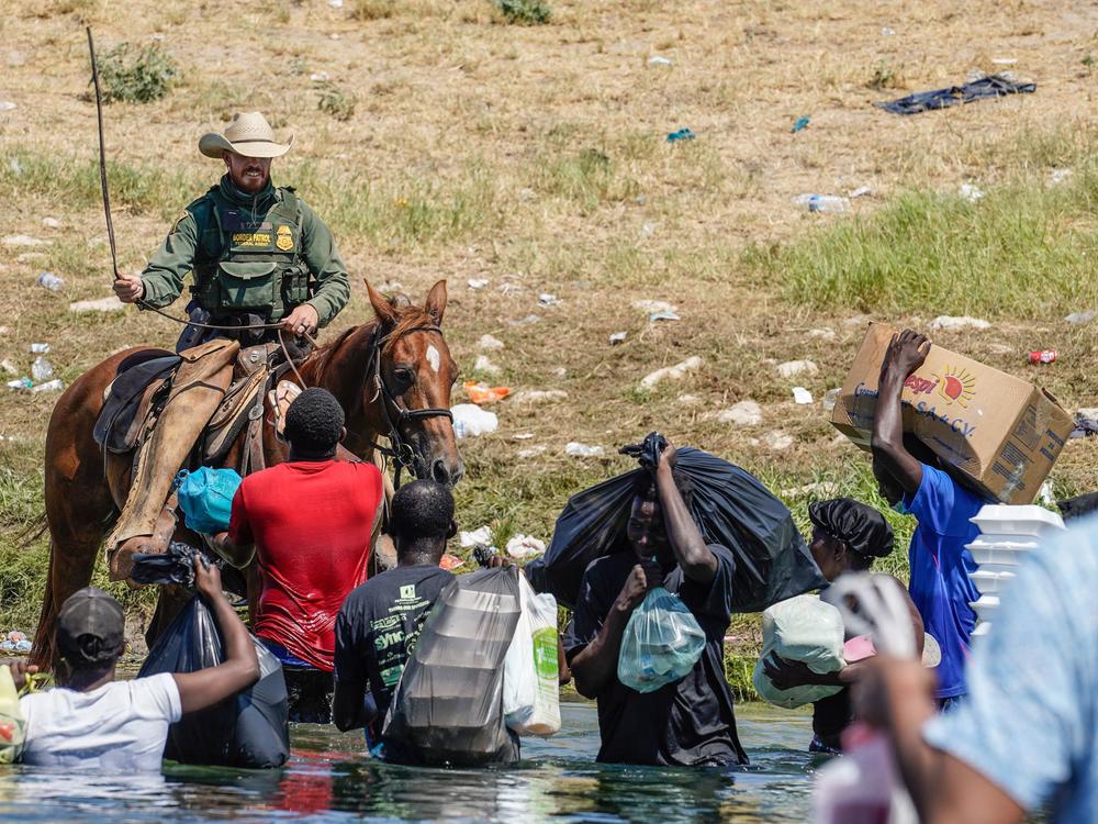 A United States Border Patrol agent on horseback uses the reins as he tries to stop Haitian migrants from entering an encampment on the banks of the Rio Grande near the Acuna Del Rio International Bridge in Del Rio, Texas on September 19, 2021.