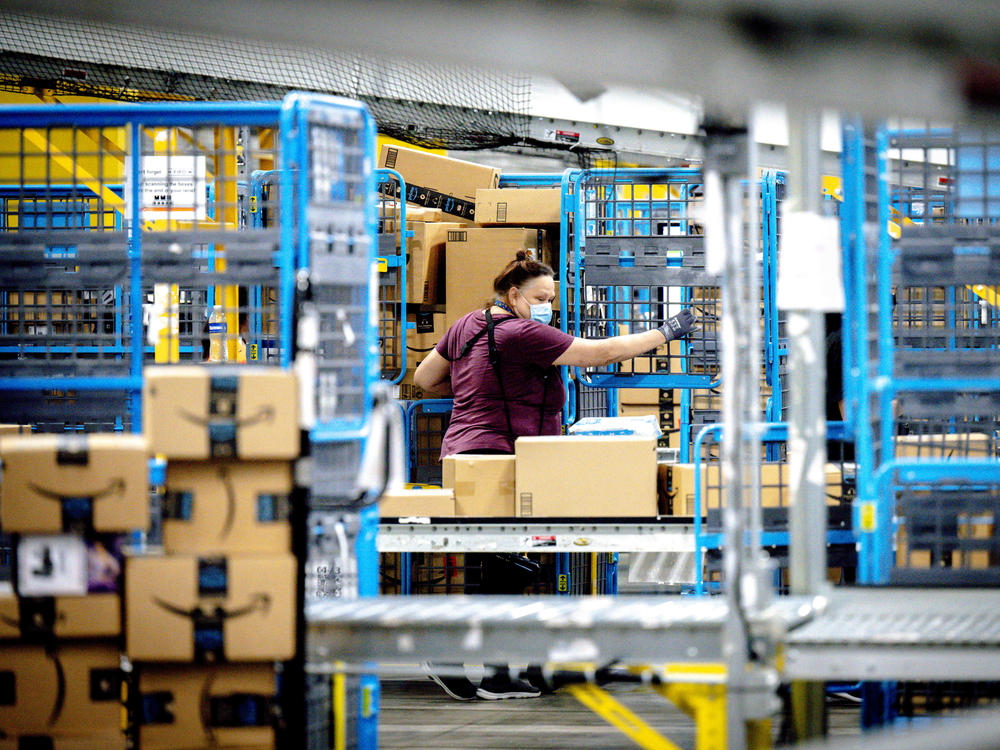 A worker sorts parcels in the outbound dock at Amazon fulfillment center in Eastvale, Calif., last month.