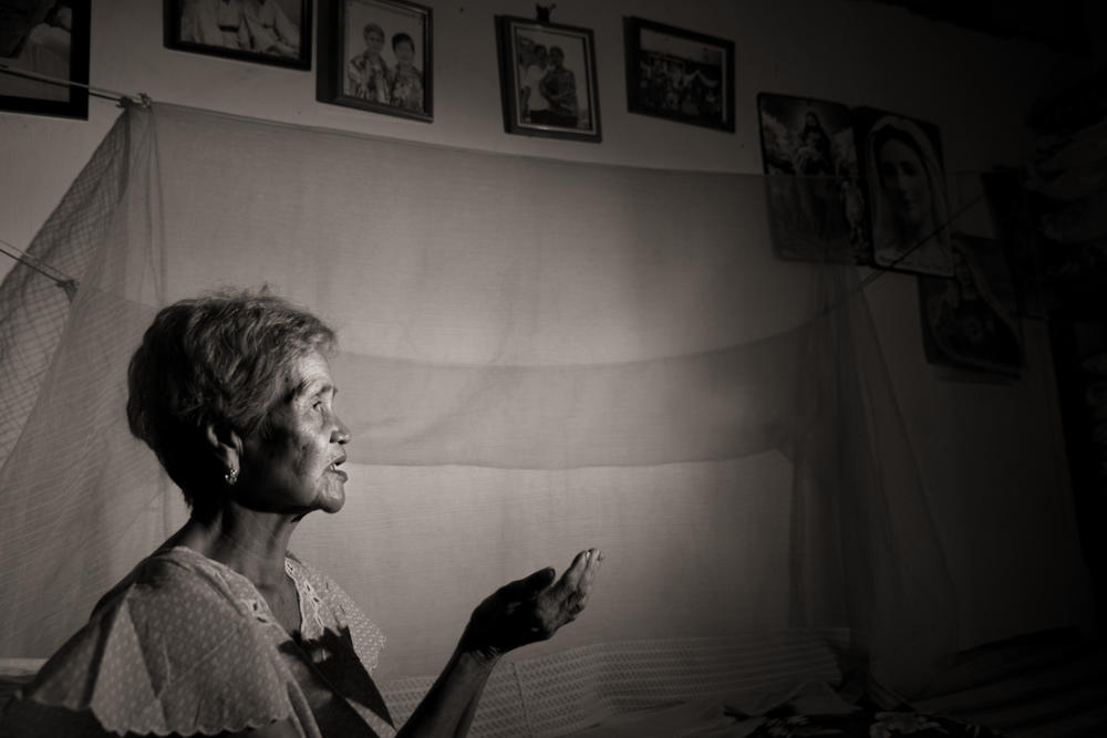 Isabelita Vinuya prays nightly for peace and forgiveness. She was 12 years old when a mass rape took place in her village of Mapaniqui.