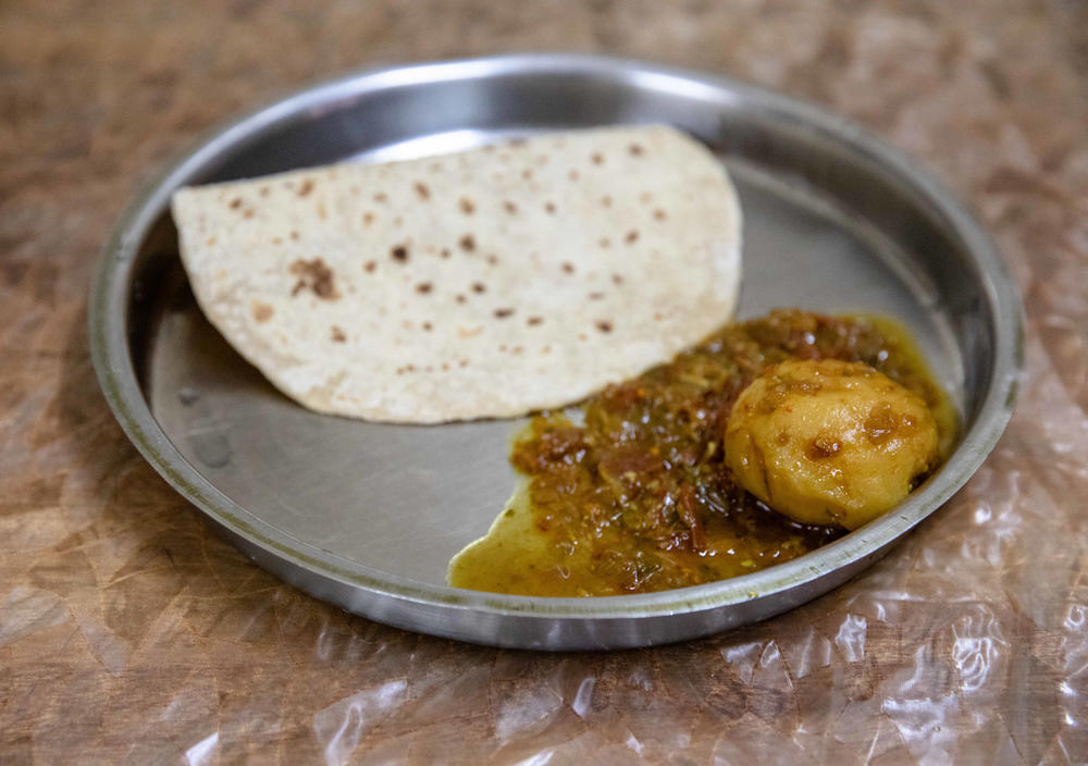 Salman's typical lunch: one piece of Indian bread and one curried potato.