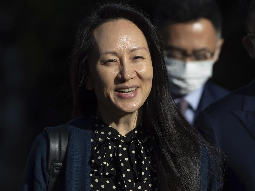 Meng Wanzhou, chief financial officer of Huawei, smiles as she leaves her home in Vancouver on Friday.