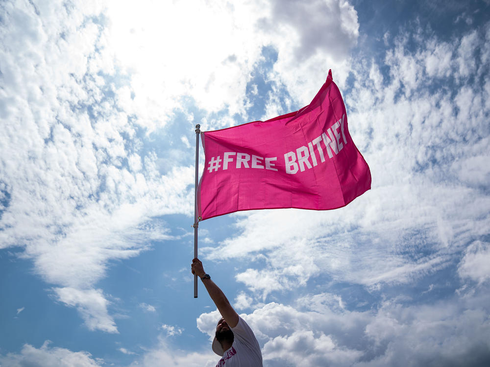A supporter of pop star Britney Spears participating in a #FreeBritney rally on July 14 in Washington, D.C. When anyone poses a high risk of harm to themselves or others, psychiatrists are obligated to hospitalize them, even against their will. For many patients, paying for that involuntary care leads to long-term financial strain.
