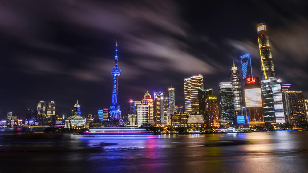Boats travel on the Huangpu River in August 2020 against the backdrop of Shanghai's skyline in the Pudong district.