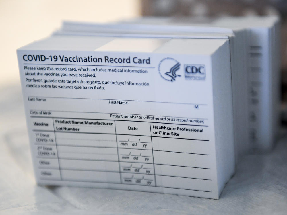 A stack of COVID-19 vaccination record cards from the Centers for Disease Control and Prevention. They provide proof that you've had your shot — but aren't exactly wallet size at 4 by 3 inches.