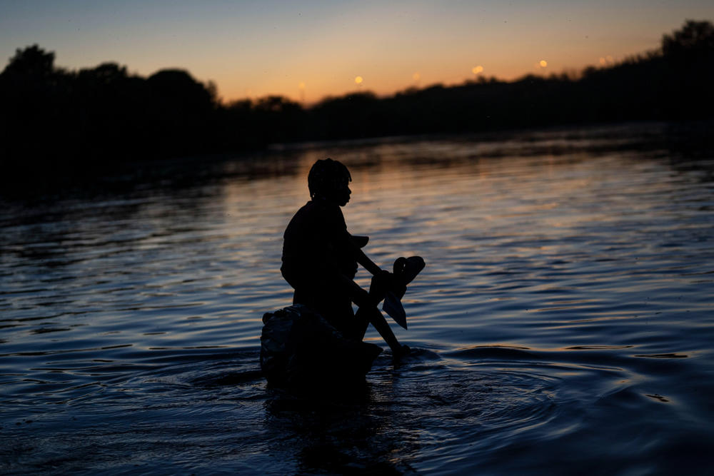 A child carried across the Rio Grande River.