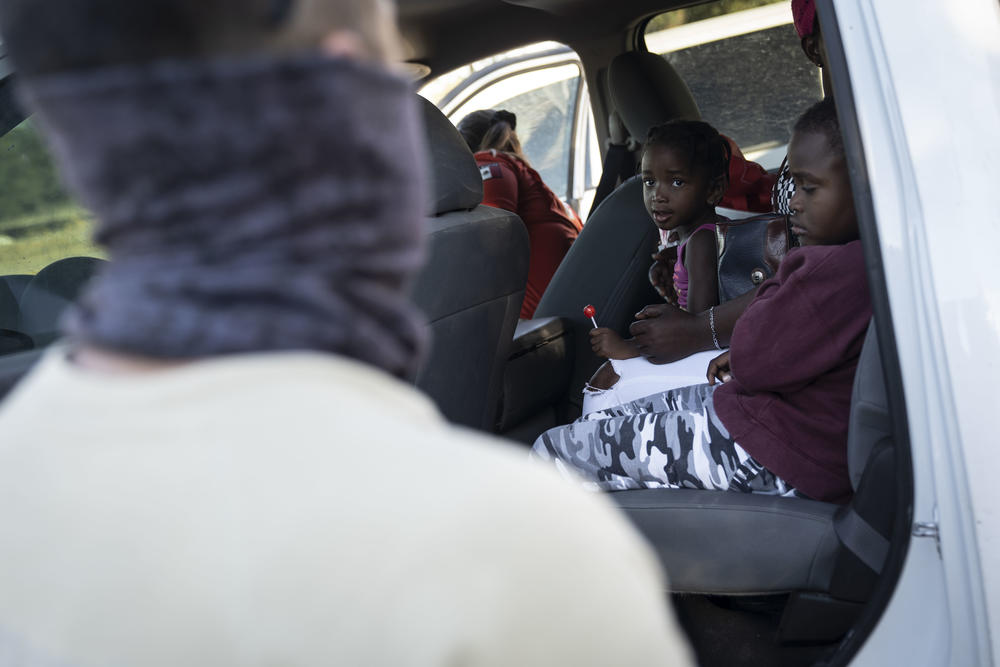 Migrants get on a truck to leave a makeshift migrant camp in Braulio Fernandez Ecological Park, to a shelter in Ciudad Acuña, Mexico.