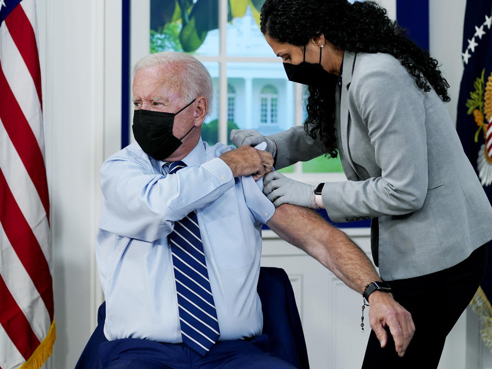 President Biden receives a COVID-19 booster shot during an event at the White House Monday.