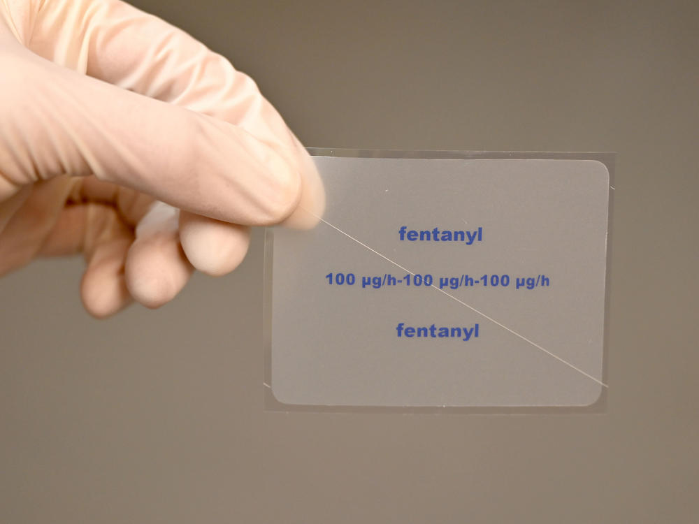 A patch containing the active ingredient fentanyl is shown by a pharmacist. The painkiller fentanyl, which can be up to 100 times stronger than heroin, is a growing cause of overdose deaths in the U.S., according to the DEA.