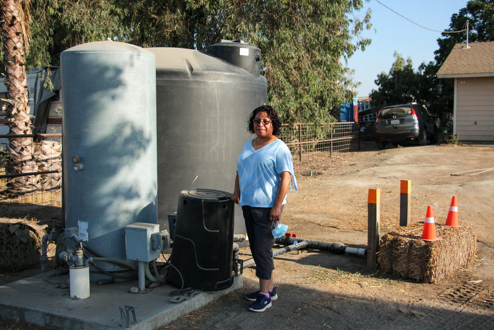 The well at Esther Espinoza's house in Riverdale, Calif., ran dry. A local nonprofit organization delivered a tank and fills it with water, but Espinoza worries that it's not a reliable water supply.