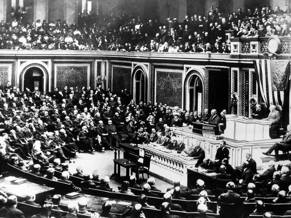 President Woodrow Wilson delivers a speech to a joint session of Congress in April 1917, requesting a declaration of war against Germany.