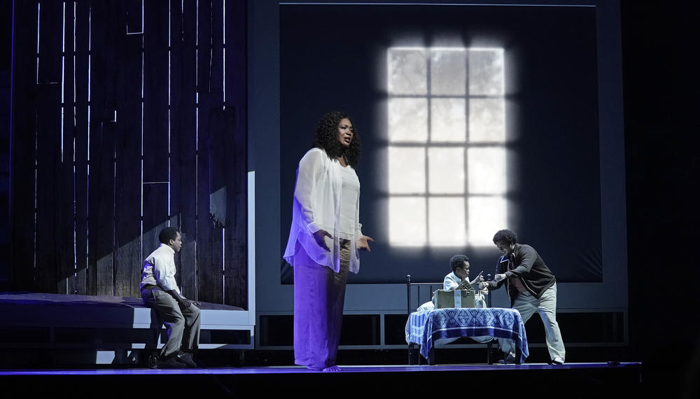 <em>Fire Shut Up in My Bones</em> features Will Liverman (left) as Charles, Angel Blue (center) as Destiny, Walter Russell III (second from right) as Char'es-Baby and Chris Kenney (far right) as Chester.