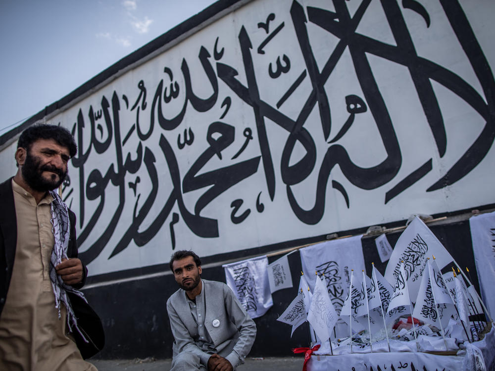 A man sells Taliban flags imprinted with the Muslim creed in Kabul, Afghanistan, on Sept. 24.