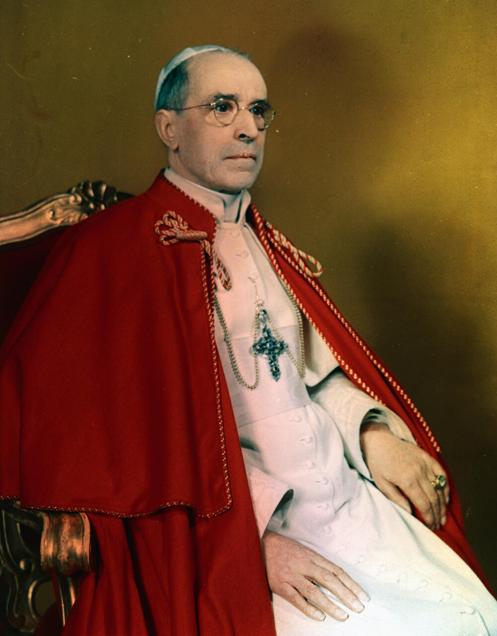 Portrait of Pope Pius XII seated on a throne.