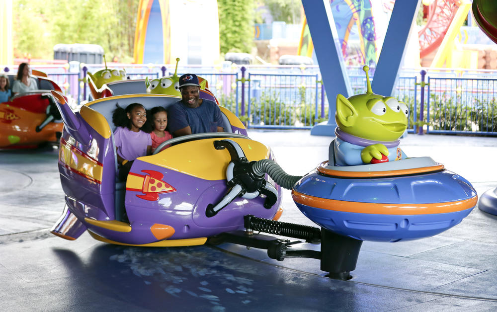 Guests ride the Alien Swirling Saucers at Toy Story Land in Disney's Hollywood Studios at Walt Disney World in 2018.