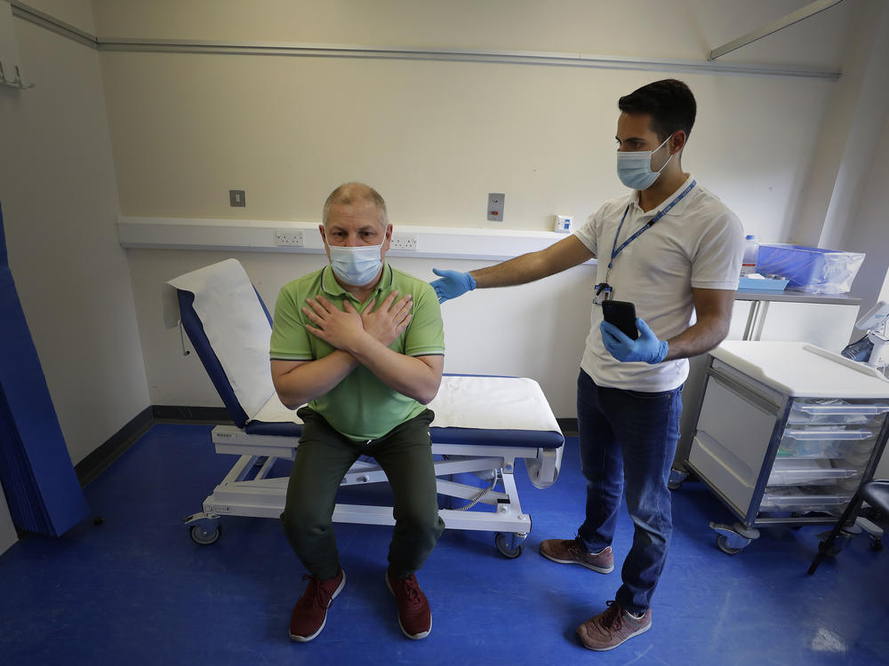Long COVID patient Gary Miller receives treatment from physiotherapist Joan Del Arco at the Long COVID Clinic at King George Hospital in Ilford, London, in May.
