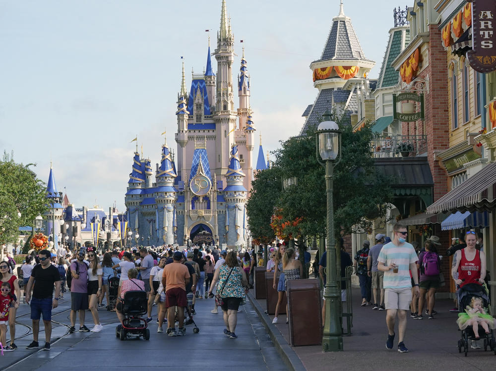 Guests stroll along Main Street at the Magic Kingdom theme park at Walt Disney World. The park celebrates its 50th anniversary on Oct. 1, 2021.