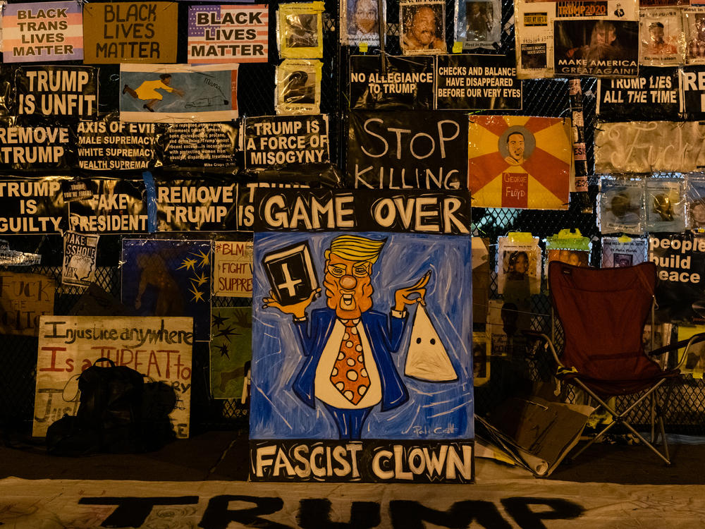 Signs on the fence surrounding the White House on Nov. 4, 2020. The majority of the artwork featured on the fence will be preserved in an archive in partnership with Baltimore's Enoch Pratt Free Library.