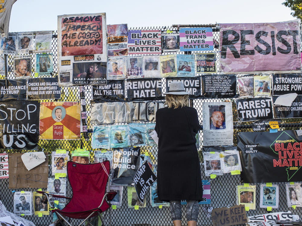 Signs on the fence surrounding the White House during the 2020 Presidential election. The fence, which came down in January 2021, once served as home to nearly 700+ signs and artwork during the course of the racial protests in D.C. following George Floyd's murder.