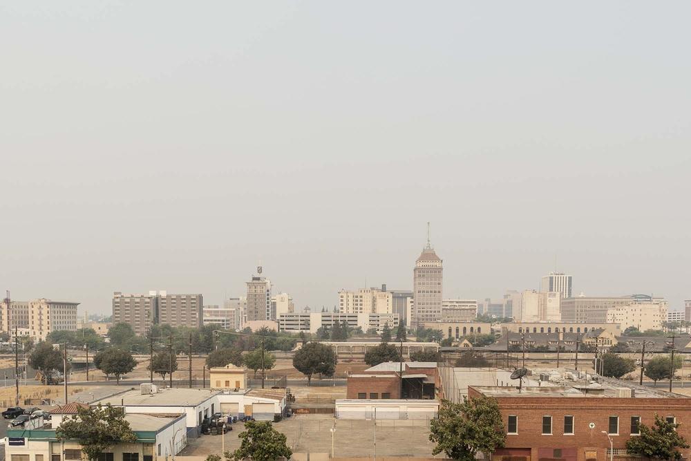 With many paved surfaces, Fresno, Calif. is often hotter than surrounding areas. Wildfire smoke has also hurt air quality.