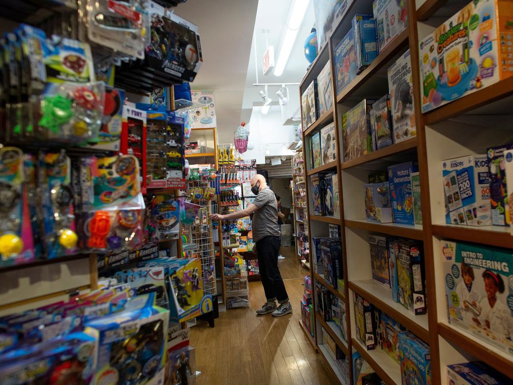 An employee organizes an aisle at Mary Arnold Toys, New York City's oldest toy store, on Aug. 2.