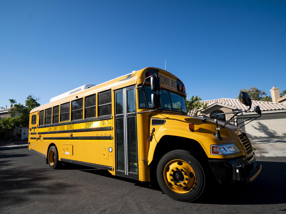 A Clark County, Nev., School District school bus drives through a Summerlin neighborhood last month. The National School Boards Association included an incident from Clark County in its letter to President Biden.