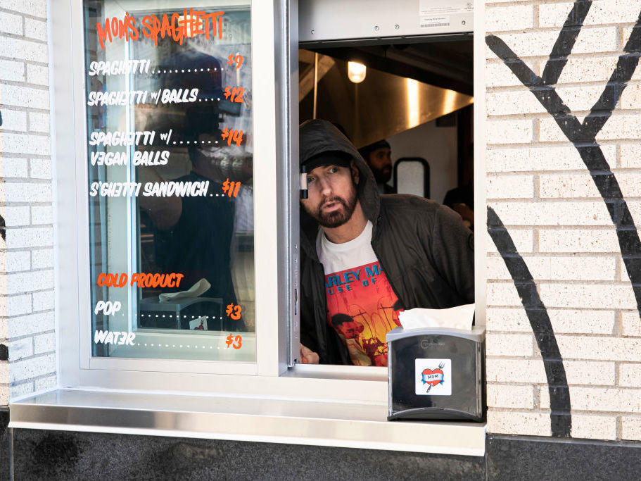 Eminem serves customers on the opening night of his restaurant Mom's Spaghetti in Detroit on Wednesday.