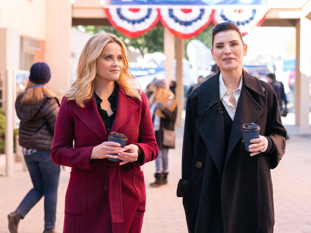 Bradley (Reese Witherspoon) and Laura (Julianna Margulies) do some talking at the Iowa caucuses.