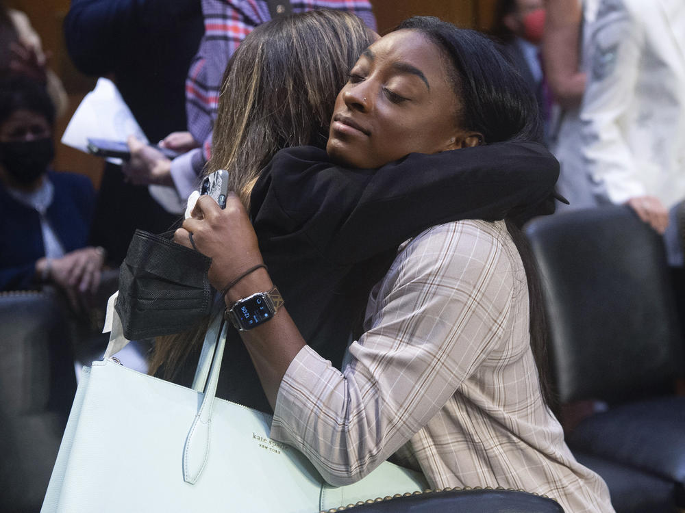 United States gymnasts Kaylee Lorincz and Simone Biles hug after a Senate Judiciary hearing about the Inspector General's report on the FBI's handling of the Larry Nassar investigation on Sept. 15, 2021.