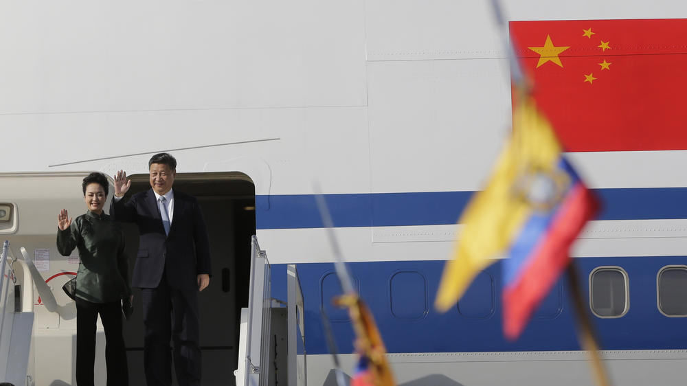 Chinese President Xi Jinping and his wife Peng Liyuan wave goodbye as they depart Quito, Ecuador, following a trip in 2016.